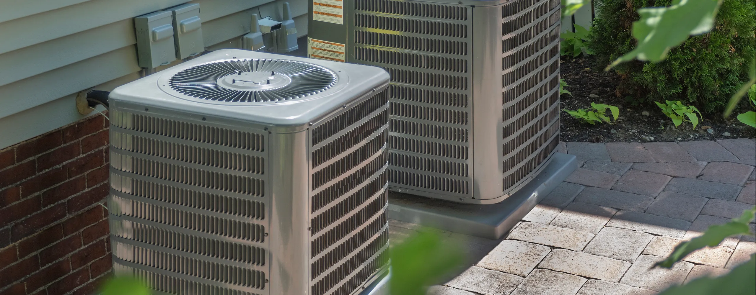 Greers Ferry Heat & Air technician servicing an HVAC system in Clinton, AR