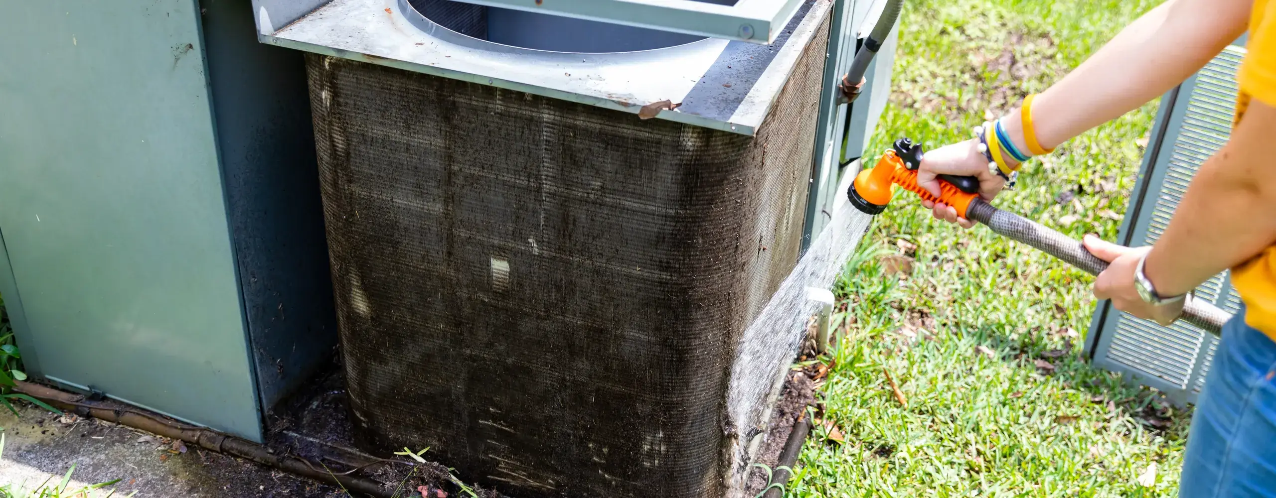 Greers Ferry Heat & Air technician servicing an all-in-one package unit in Greers Ferry, AR