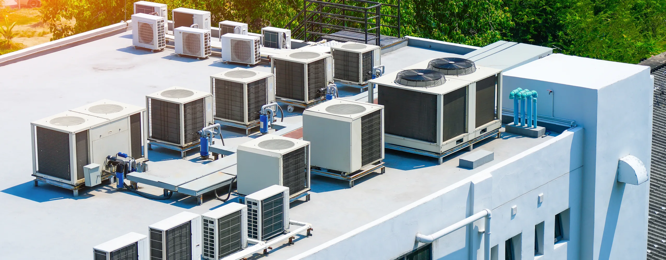 Greers Ferry Heat & Air technician servicing a rooftop HVAC unit in Greers Ferry, AR