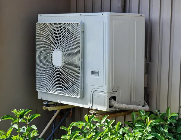 Greers Ferry Heat & Air technician installing a wall-mounted ductless mini-split indoor unit