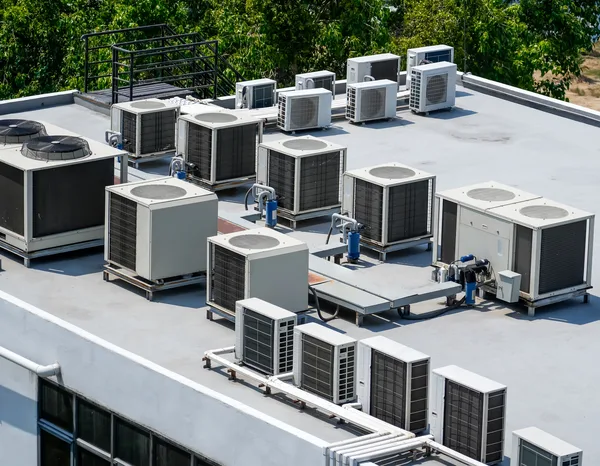 Greers Ferry Heat & Air technician servicing a packaged rooftop HVAC unit