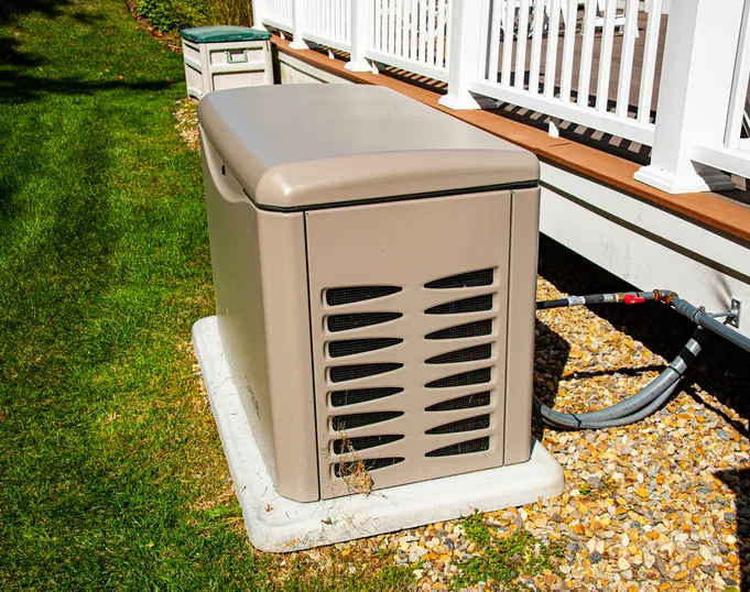 Standby generator installed beside a central Arkansas home